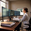 Doctor seated at a workstation reviewing medical images and patient records on multiple computer monitors.

Veterans Nexus INSTITUTE